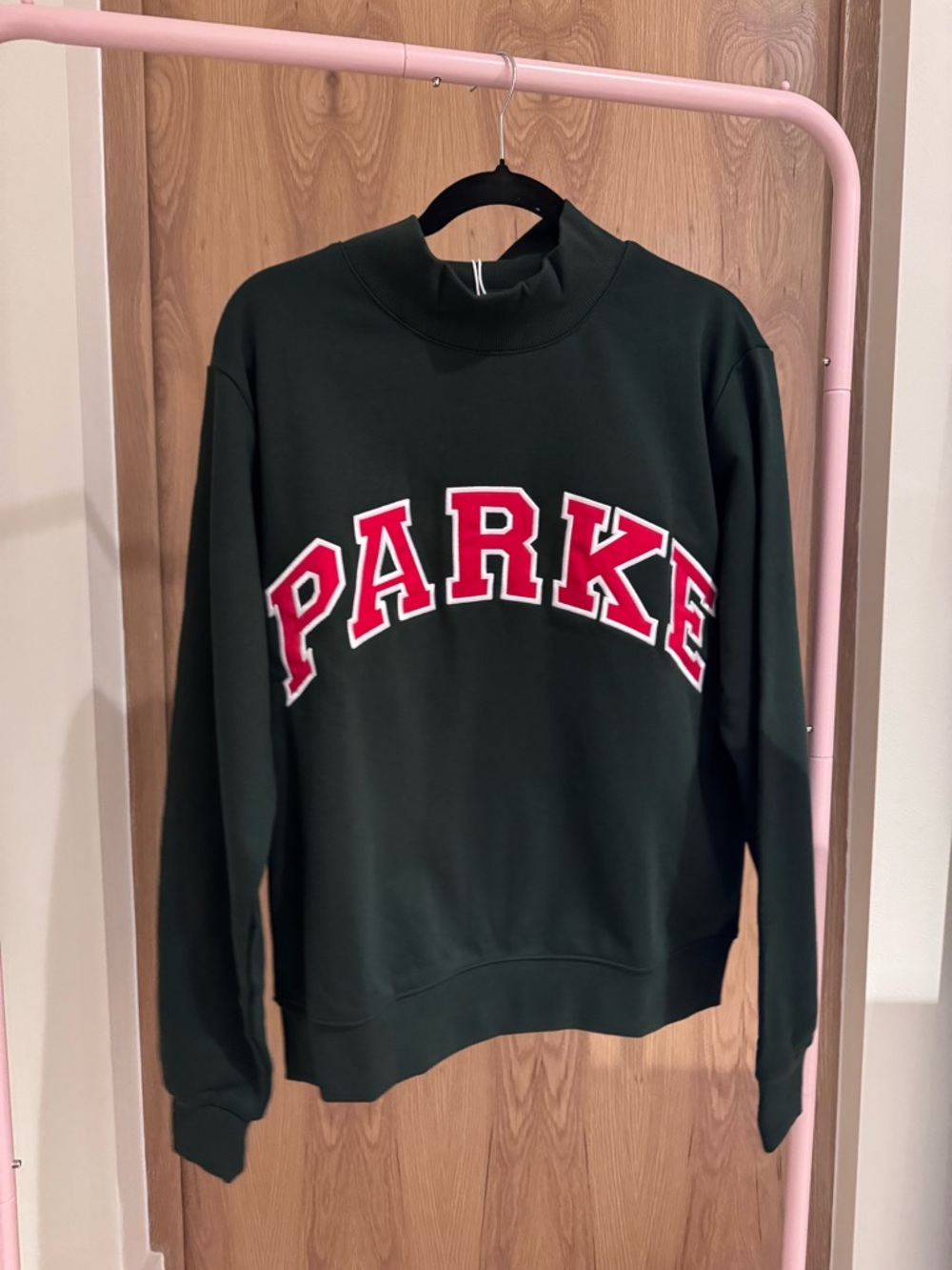 Dark Green Crewneck Sweater with Red 'PARKE' Appliqué